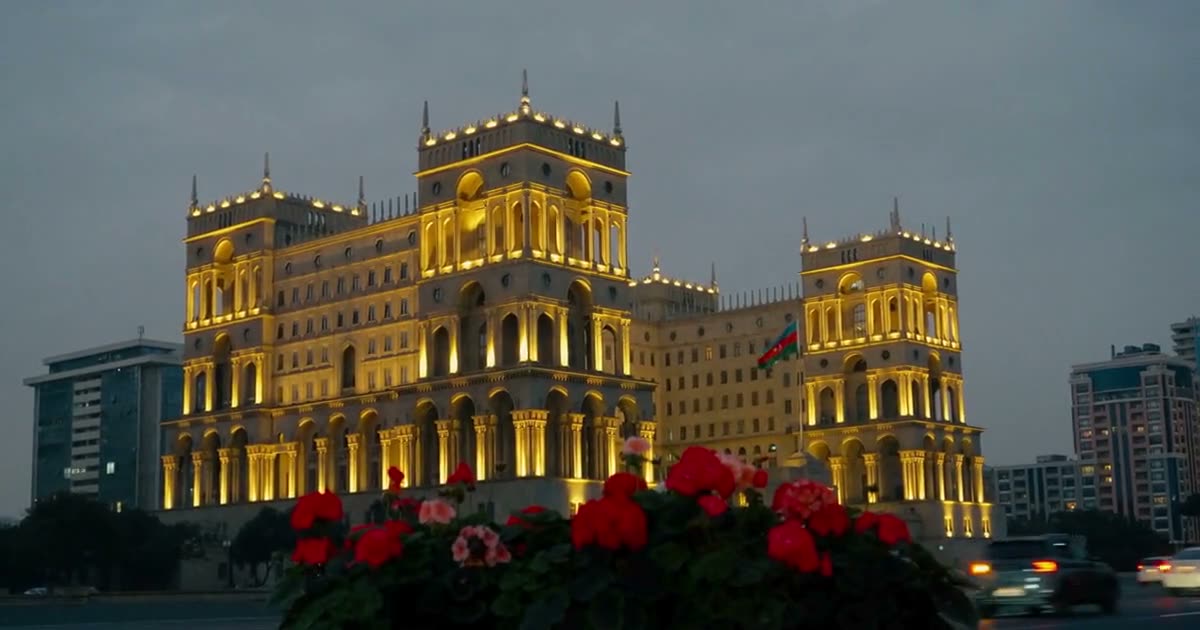 Baku Travel Guide — Government House glowing gold at dusk