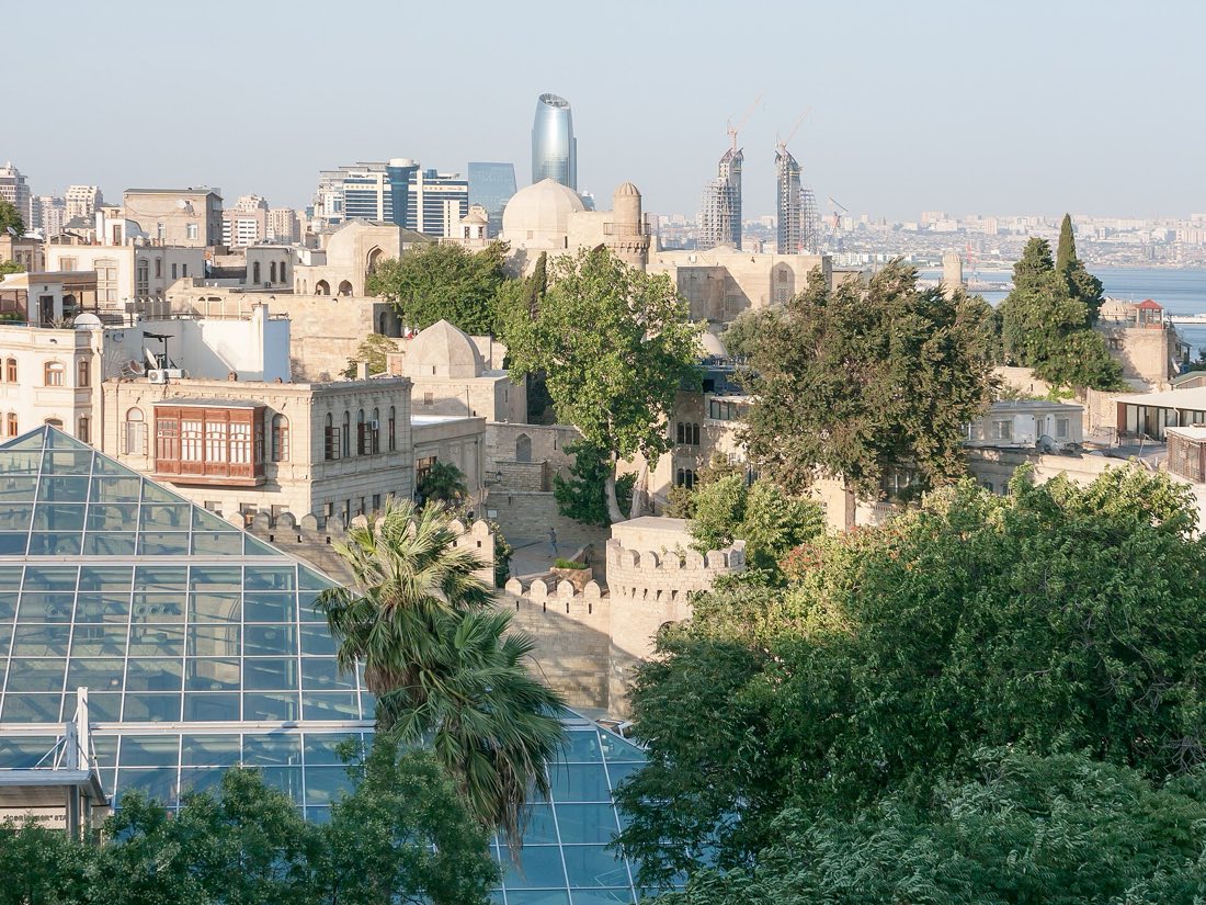 Icherisheher — Baku Old City rooftops with the modern skyline behind